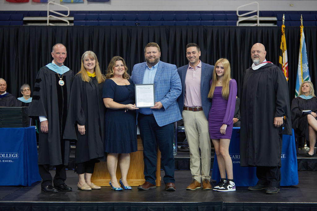 family of terry kasecamp accepting emertius award